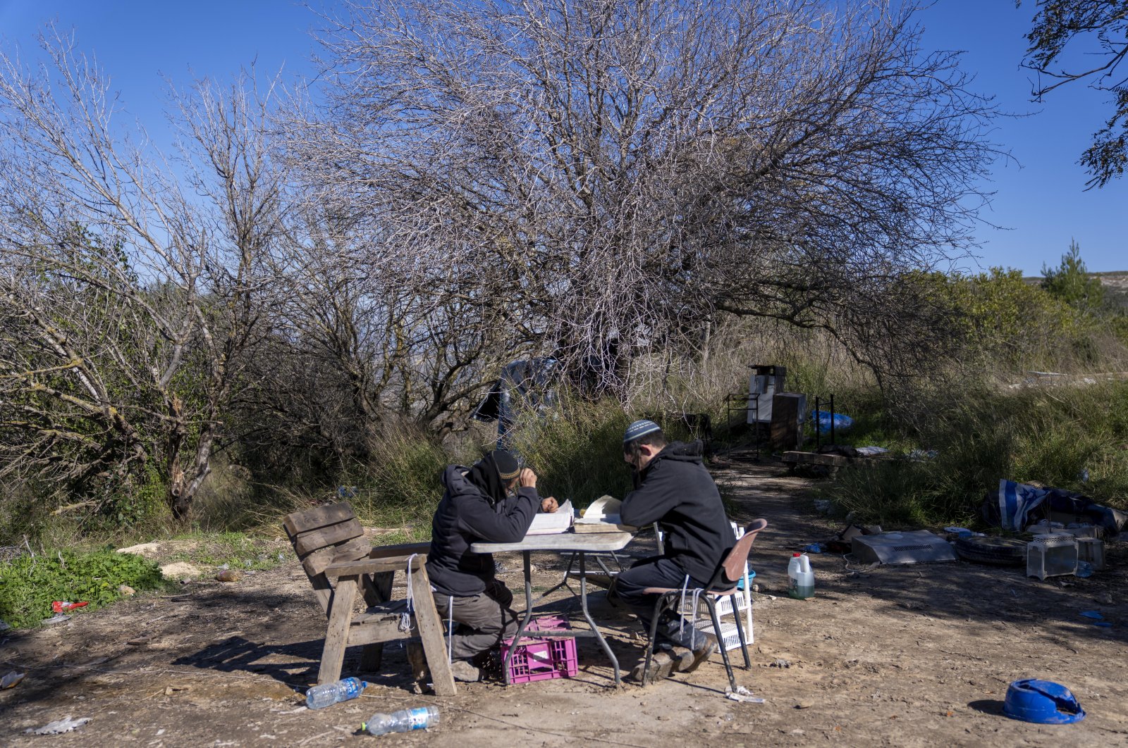 Jewish settlers study Torah at the West Bank outpost of Homesh, near the Palestinian village of Burqa, Jan. 17, 2022. (AP Photo)