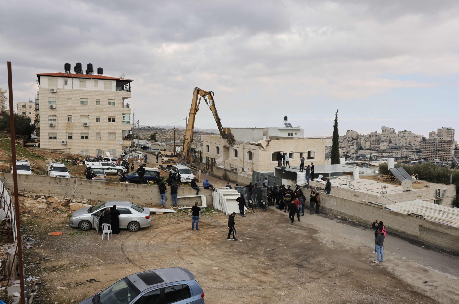 Israeli machinery demolishes a Palestinian house in al-Tur, East Jerusalem, occupied Palestine, Jan. 25, 2022. (AFP Photo)