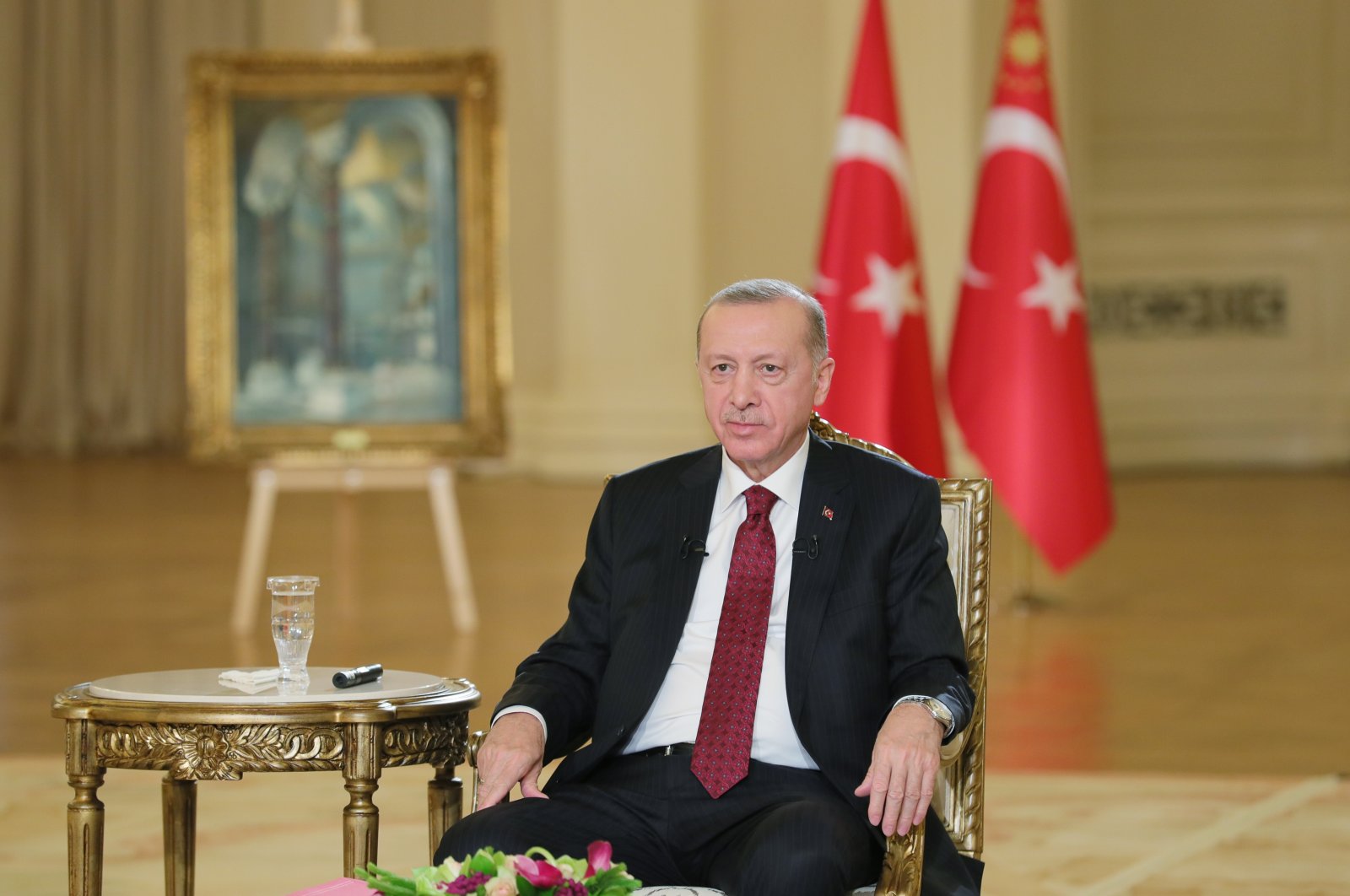 President Recep Tayyip Erdoğan listens during the televised broadcast on Jan. 26, 2022 (AA Photo)