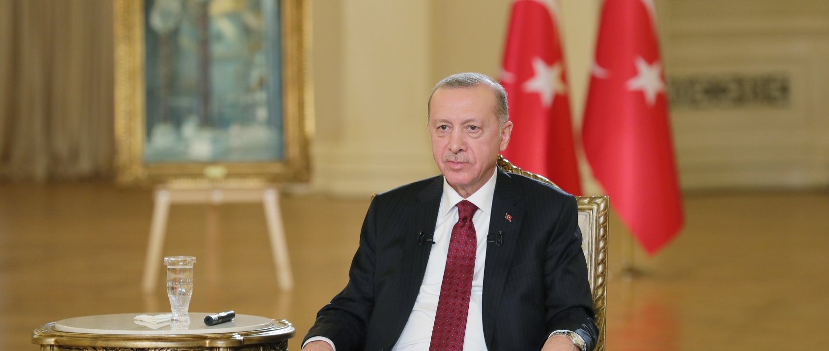 President Recep Tayyip Erdoğan listens during the televised broadcast on Jan. 26, 2022 (AA Photo)
