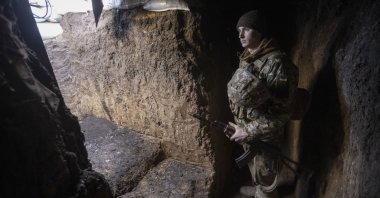 An Ukrainian soldier stands in the trench on the line of separation from pro-Russian rebels, in Mariupol, Donetsk region, Ukraine, Jan. 20, 2022. (AP Photo)