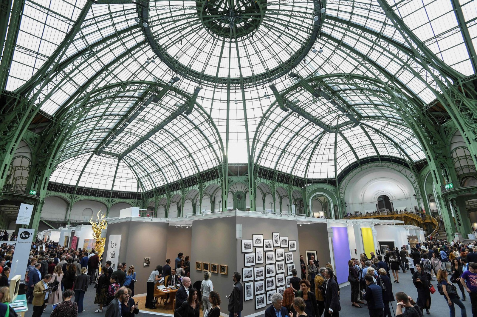 This file photograph shows visitors at the Paris International Contemporary Art Fair (Foire Internationale d&#039;Art Contemporain - FIAC) at The Grand Palais, in Paris, Oct. 18, 2017, (AFP Photo)