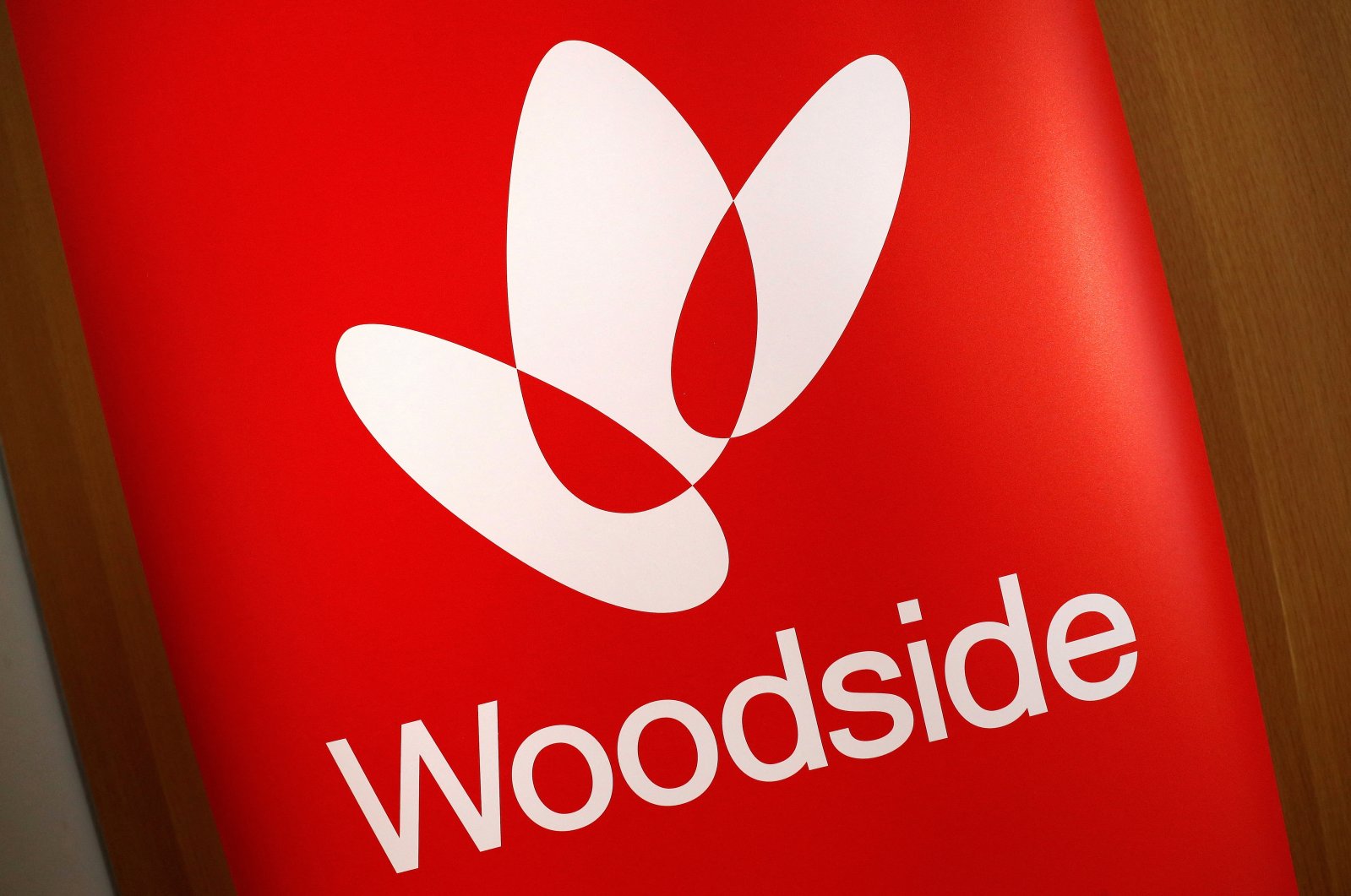 The logo for Woodside Petroleum adorns a promotional poster on display at a briefing for investors in Sydney, Australia, May 23, 2018. (Reuters Photo)