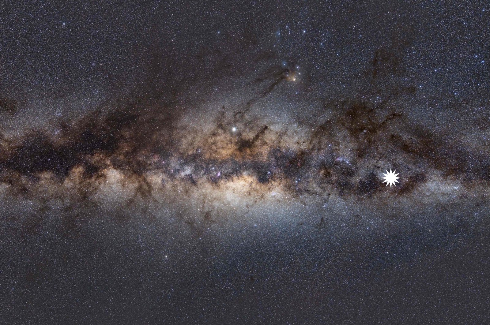 This handout image by astrophysicist Natasha Hurley-Walker from the Curtin University node of the International Center for Radio Astronomy Research (ICRAR) shows the Milky Way as viewed from Earth, with a star icon (at R-placed by source) marking the position of a mysterious repeating transient in space, Jan. 26, 2022. (Photo via AFP)