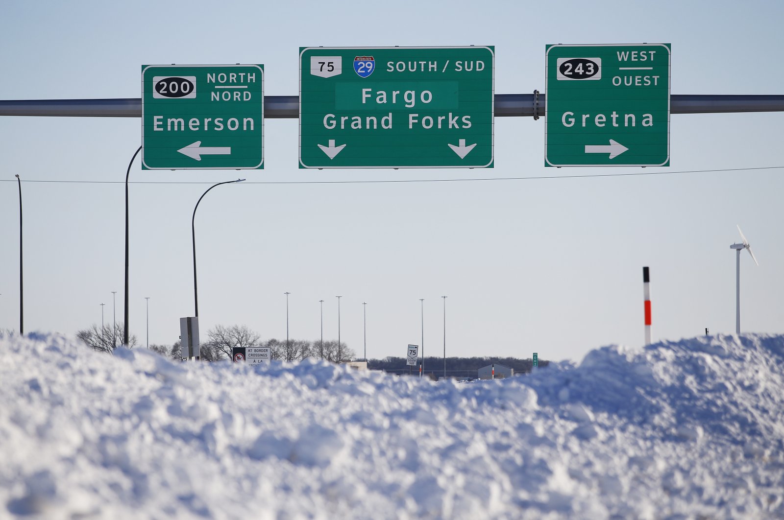Road signage is posted just outside of Emerson, Manitoba, Canada, Jan. 20, 2022. (AP Photo)