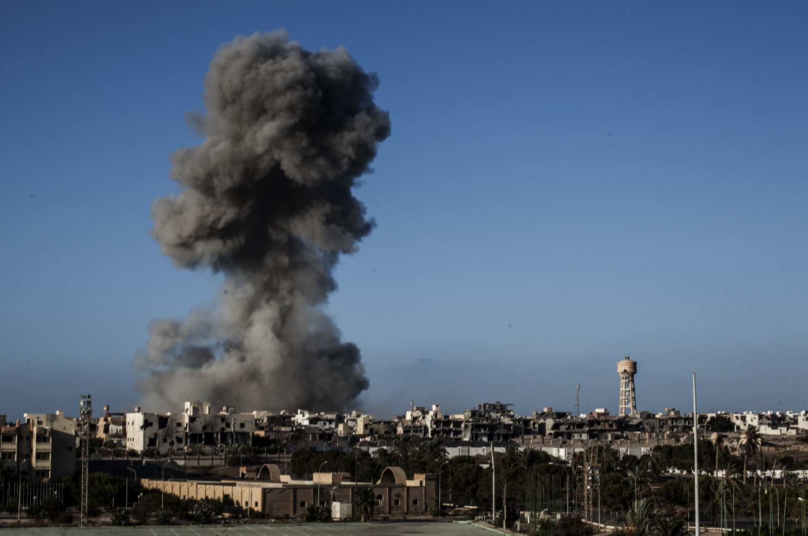 Smoke rises after an airstrike on a Daesh terrorist-held area in Sirte, Libya, Sept. 28, 2016. (AP File Photo)