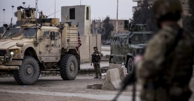U.S. soldiers stand guard in Hassakeh, northeast Syria, Jan. 27, 2022. (AP Photo)
