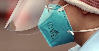 Linsey Jones, a medical assistant working at a drive-up COVID-19 testing clinic, wears an N95 mask, Jan. 4, 2022, Puyallup, Washington, south of Seattle, U.S. (AP Photo)