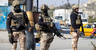 Iraqi soldiers man a checkpoint following a reported rocket attack on the country's airport in the capital Baghdad, Iraq, Jan. 28, 2022. (AFP Photo)