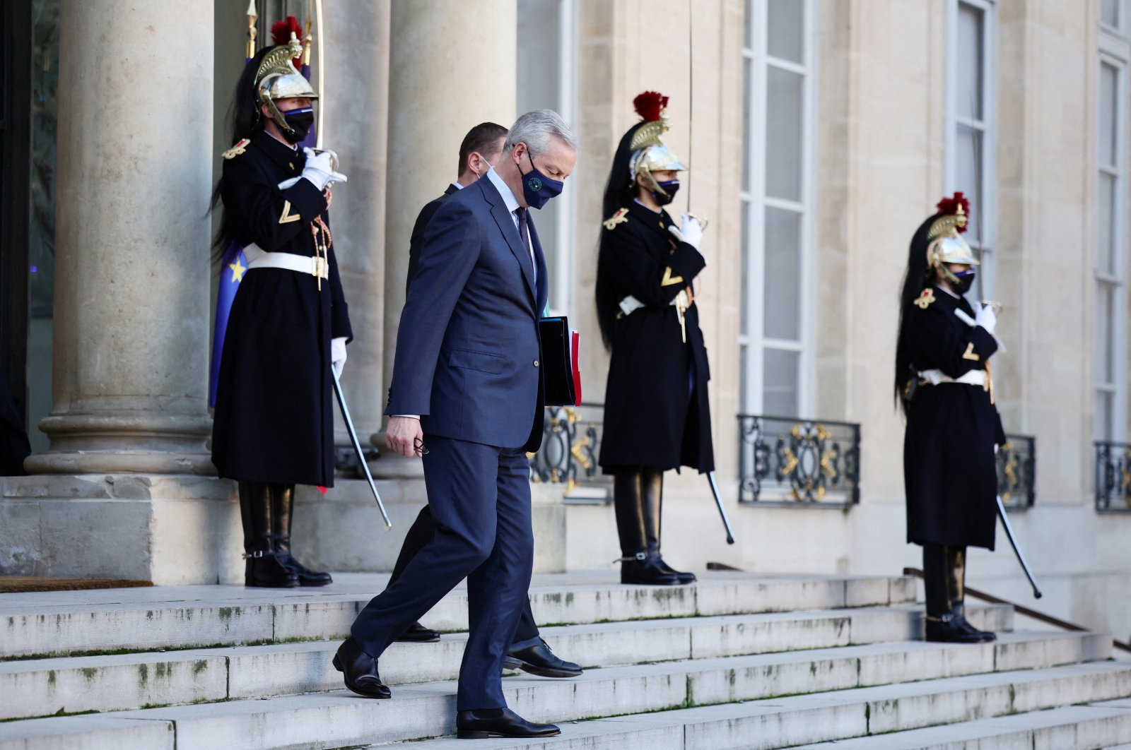 French Economy and Finance Minister Bruno Le Maire, wearing a protective face mask, leaves following the first weekly Cabinet meeting of the year at the Elysee Palace in Paris, France, Jan. 5, 2022. (Reuters Photo)