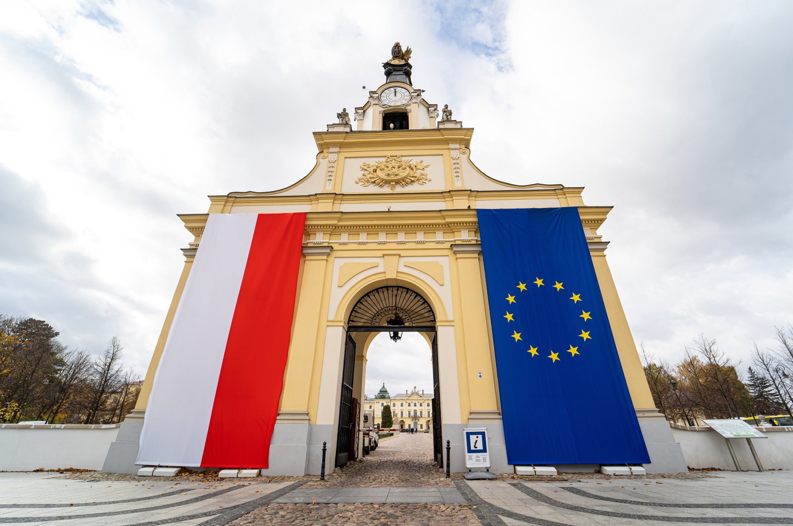 Polish and European Union flags on the entrance gate to the Branicki Palace in Bialystok, Poland, Oct. 22, 2021. (Photo by Shutterstock)