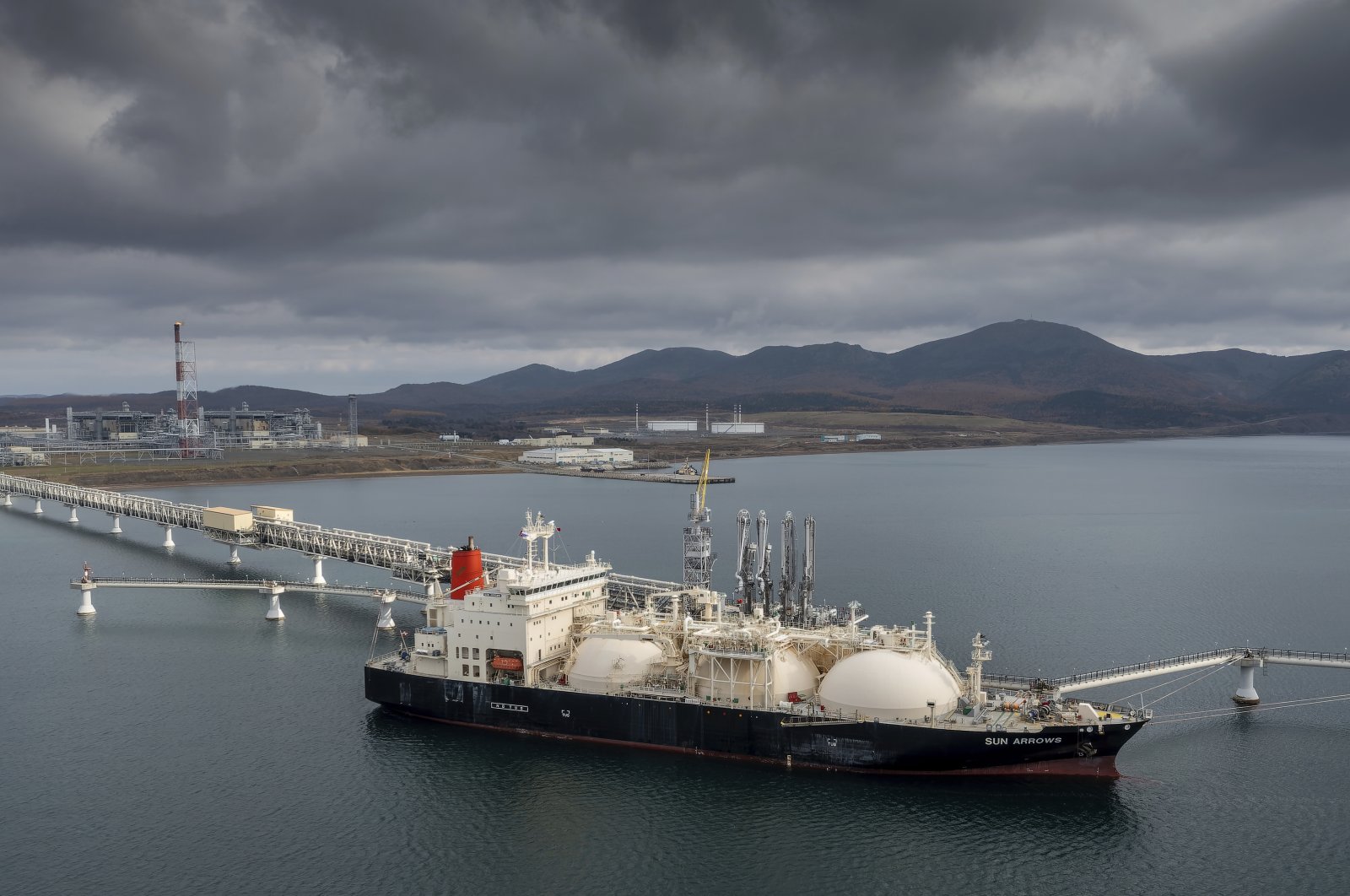 The tanker Sun Arrows loads its cargo of liquefied natural gas from the Sakhalin-2 project in the port of Prigorodnoye, Russia, Oct. 29, 2021. (AP Photo)