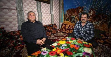 Sadri Ahmedov (L), head of the Association of Ahıska Turks of the Donetsk region, and Iskender Osmanov speak to AA in an interview, Donbass, Ukraine, Jan. 29, 2022. (AA Photo)