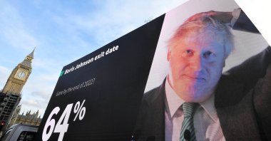 An electronic billboard displaying a prediction for the departure of British Prime Minister Boris Johnson is driven near the Houses of Parliament in London, Britain, Jan. 28, 2022. (Reuters Photo)