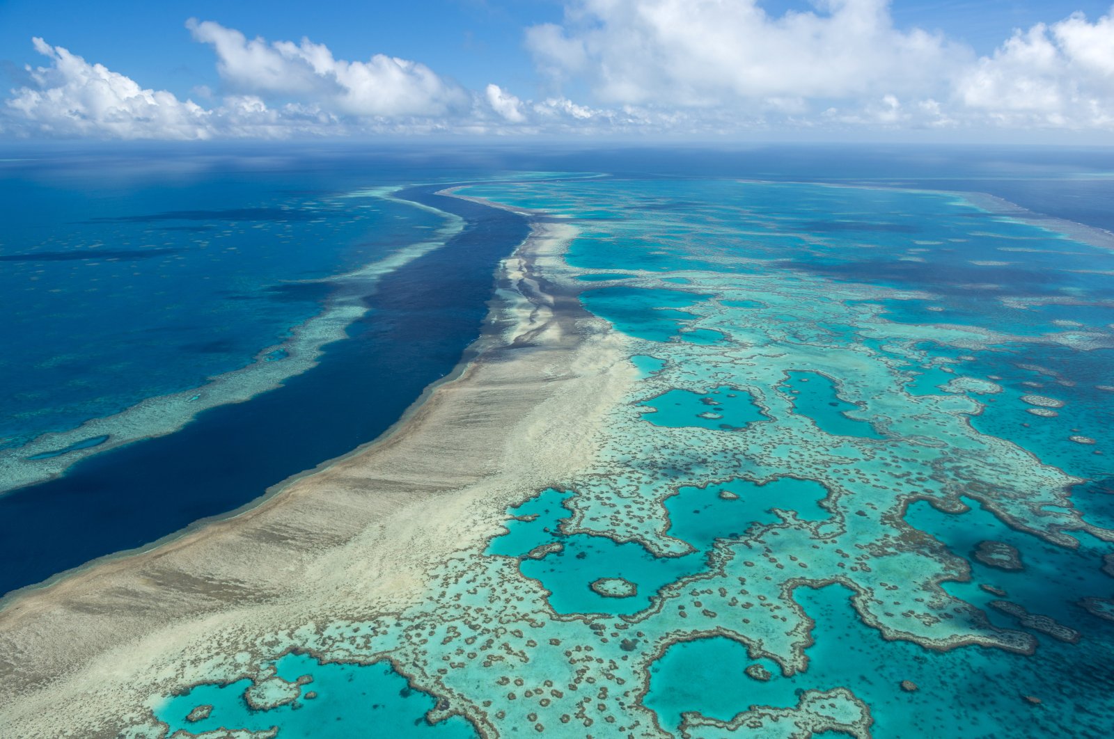 In this photo provided by the Great Barrier Reef Marine Park Authority, the Hardy Reef is viewed from the air near the Whitsunday Islands, Australia, June 22, 2014. (Jumbo Aerial Photography/Great Barrier Reef Marine Park Authority via AP)