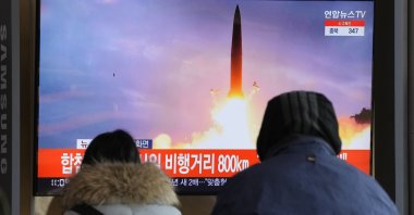 People watch a TV showing a file image of North Korea's missile launch during a news program at the Seoul Railway Station in Seoul, South Korea, Sunday, Jan. 30, 2022. (AP Photo)