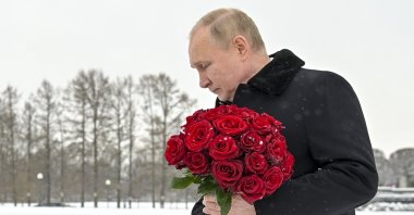 Russian President Vladimir Putin attends a wreath-laying commemoration ceremony at the Piskaryovskoye cemetery where most of the Leningrad siege victims were buried during World War II, in St. Petersburg, Russia, Jan. 27, 2022. (AP Photo)