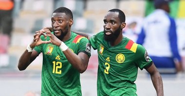 Cameroon forward Karl Toko Ekambi (L) celebrates with teammate Moumi Ngamaleu after scoring his team&#039;s first goal during the AFCON quarterfinal match against Gambia, Douala, Cameroon, Jan. 29, 2022. (AFP Photo)