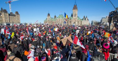 Supporters arrive at Parliament Hill for the Freedom Truck Convoy to protest against COVID-19 vaccine mandates and restrictions in Ottawa, Canada, Jan. 29, 2022. (AFP Photo)