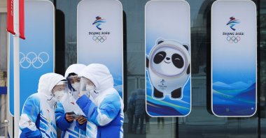 Beijing 2022 Winter Olympics volunteers in face masks and shields are seen at National Aquatics Center, Beijing, China, Jan. 30, 2022. (Reuters Photo)