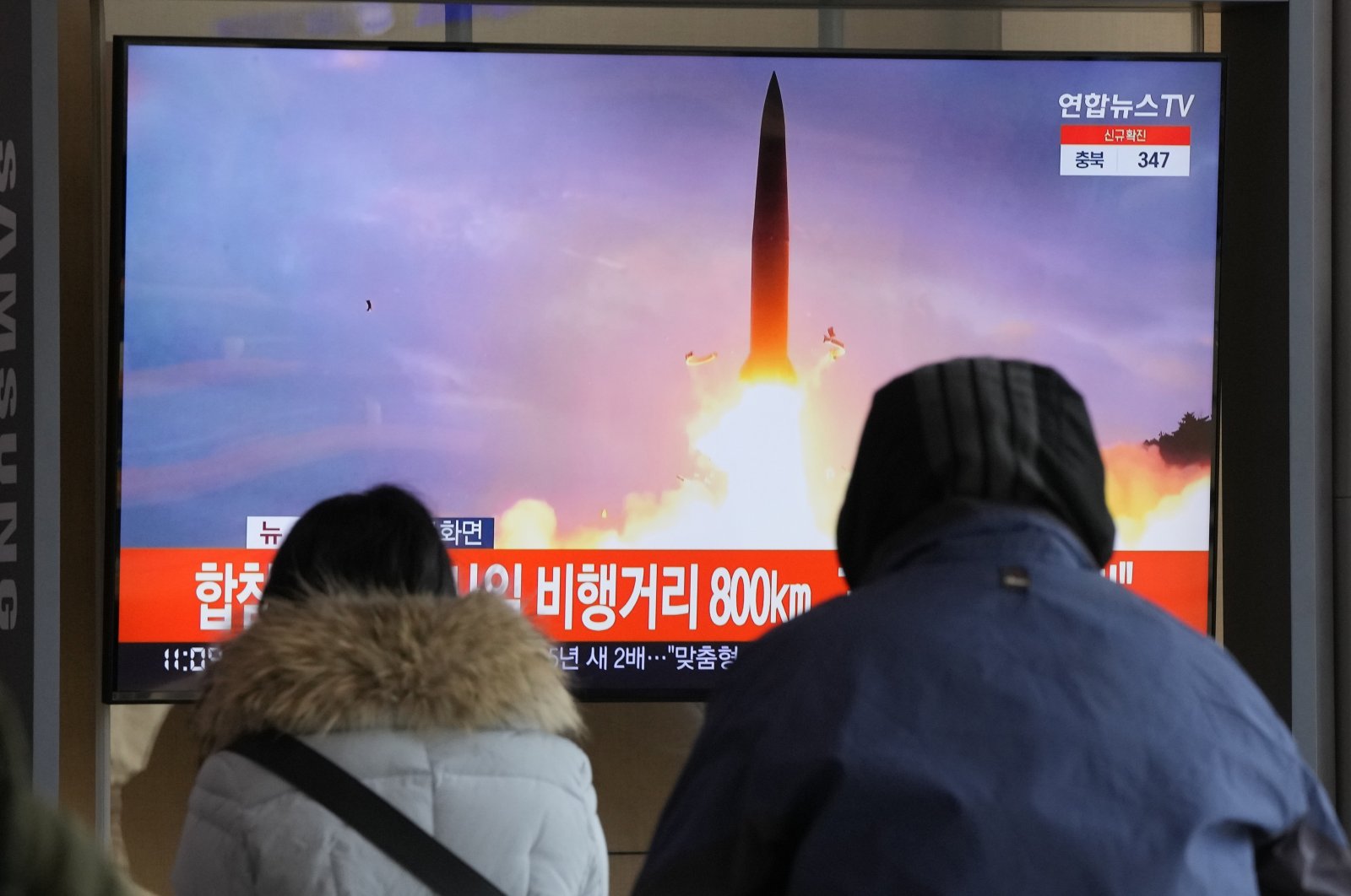 People watch a TV showing a file image of North Korea&#039;s missile launch during a news program at the Seoul Railway Station in Seoul, South Korea, Sunday, Jan. 30, 2022. (AP Photo)