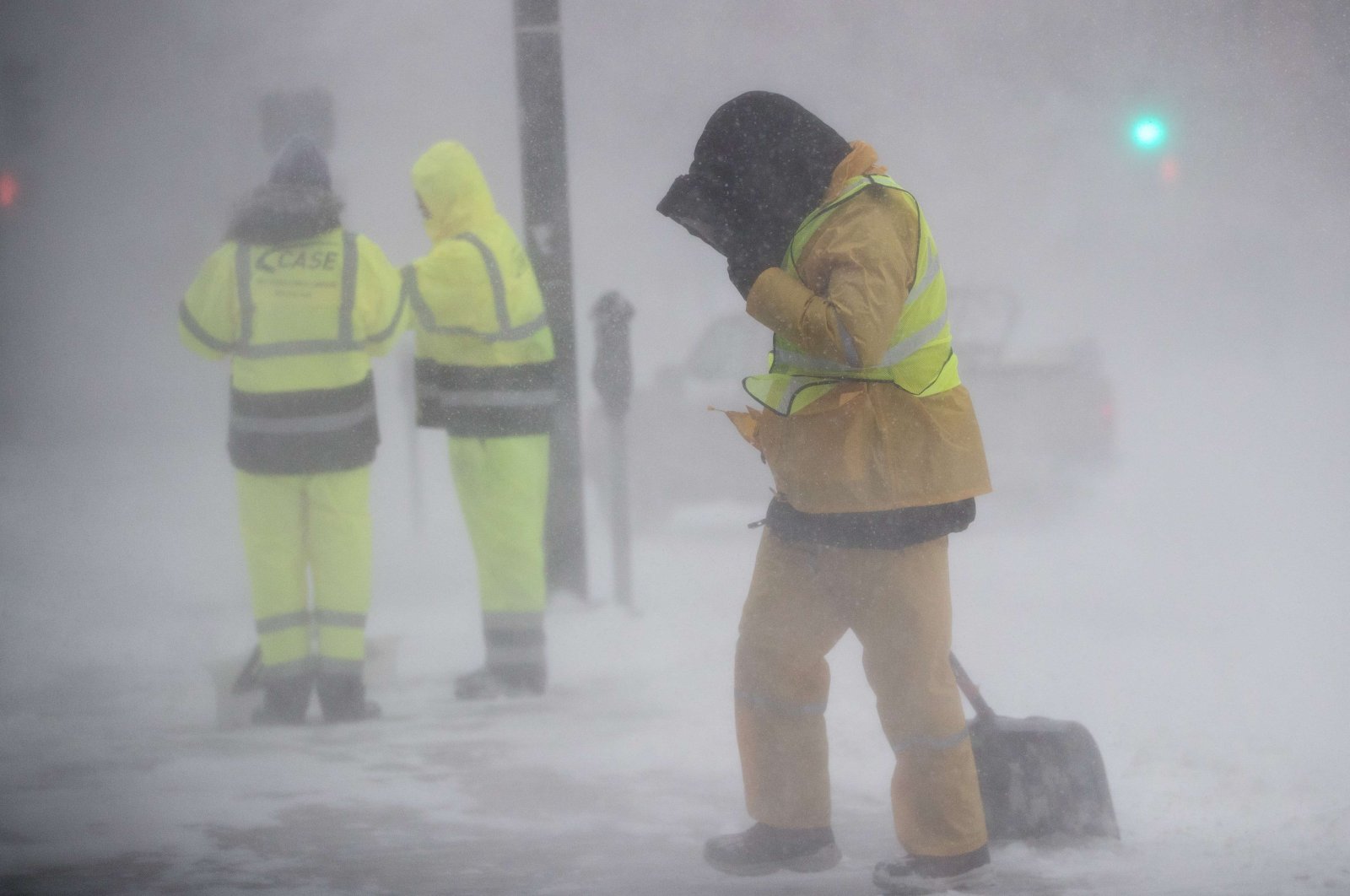 A worker shields himself from blowing snow and wind as Winter Storm Kenan bears down on Boston, Massachusetts, U.S., Jan. 29, 2022. (Getty Images / AFP)