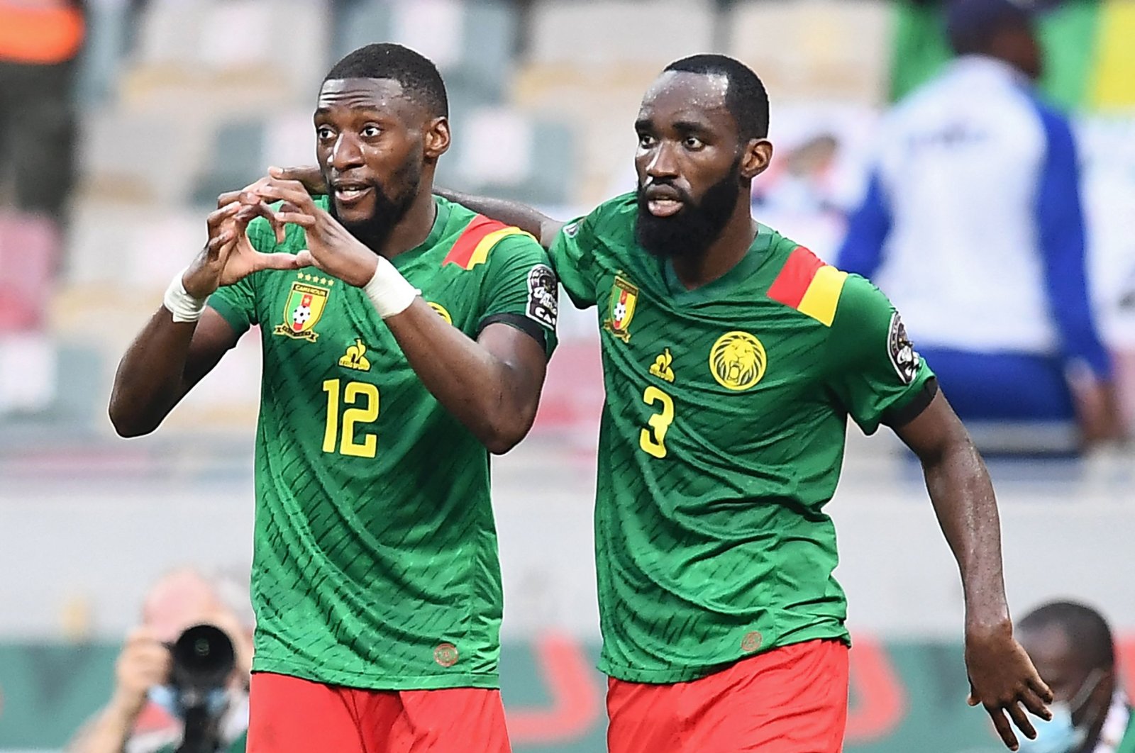 Cameroon forward Karl Toko Ekambi (L) celebrates with teammate Moumi Ngamaleu after scoring his team&#039;s first goal during the AFCON quarterfinal match against Gambia, Douala, Cameroon, Jan. 29, 2022. (AFP Photo)
