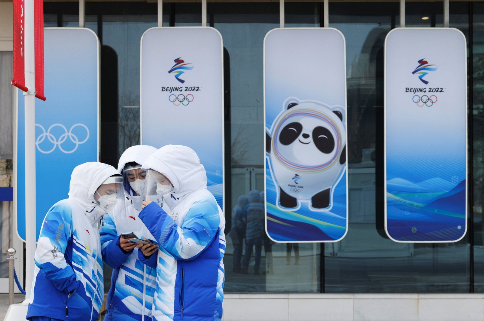 Beijing 2022 Winter Olympics volunteers in face masks and shields are seen at National Aquatics Center, Beijing, China, Jan. 30, 2022. (Reuters Photo)