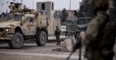 U.S. soldiers stand guard in Hassakeh, northeast Syria, Jan. 27, 2022. (AP Photo)