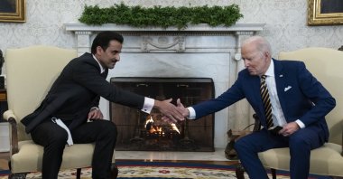 U.S. President Joe Biden (R) shakes hands with Qatar's Emir Sheikh Tamim bin Hamad Al Thani in the Oval Office of the White House, U.S., Jan. 31, 2022. (AP Photo)