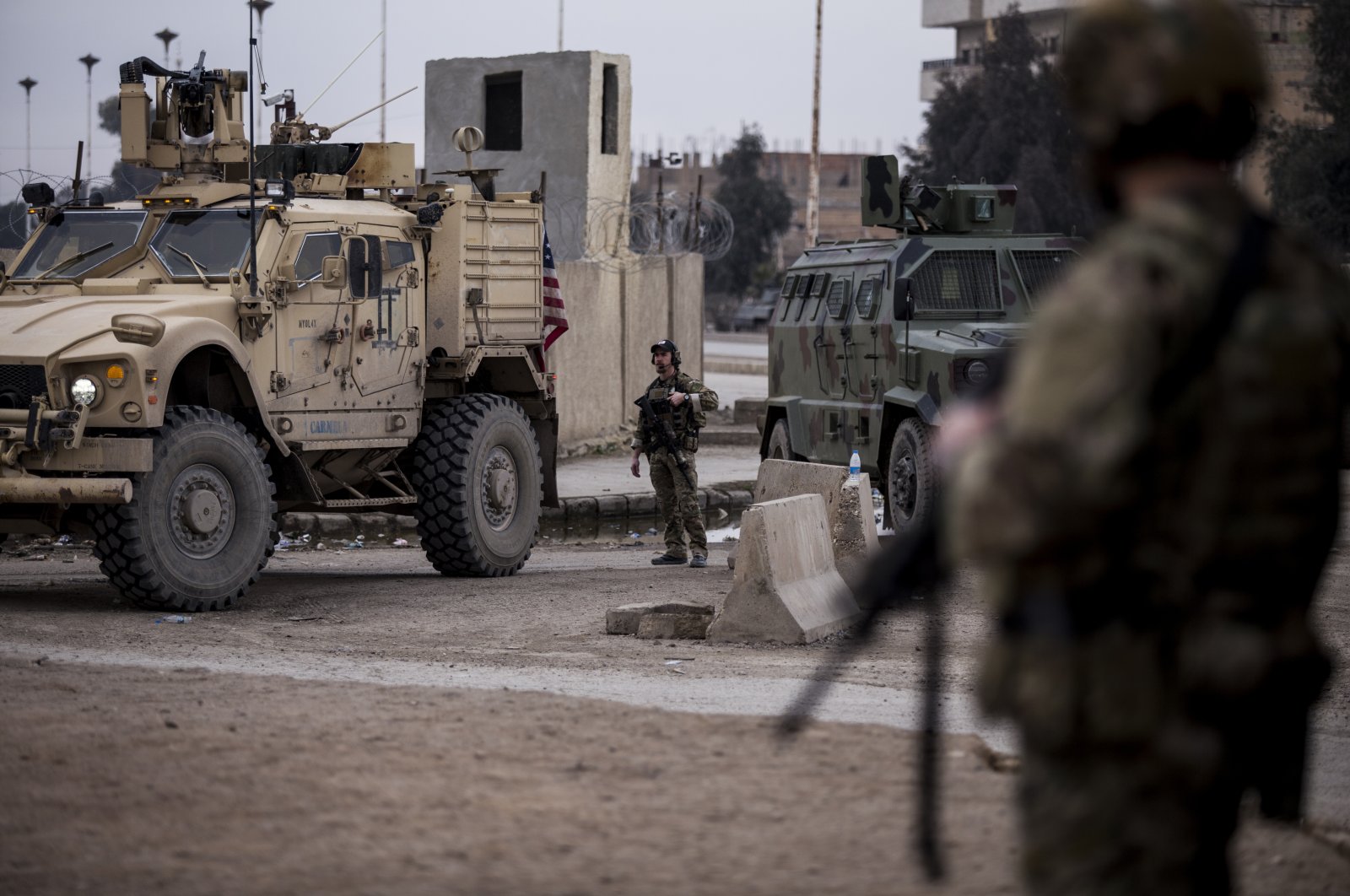 U.S. soldiers stand guard in Hassakeh, northeast Syria, Jan. 27, 2022. (AP Photo)