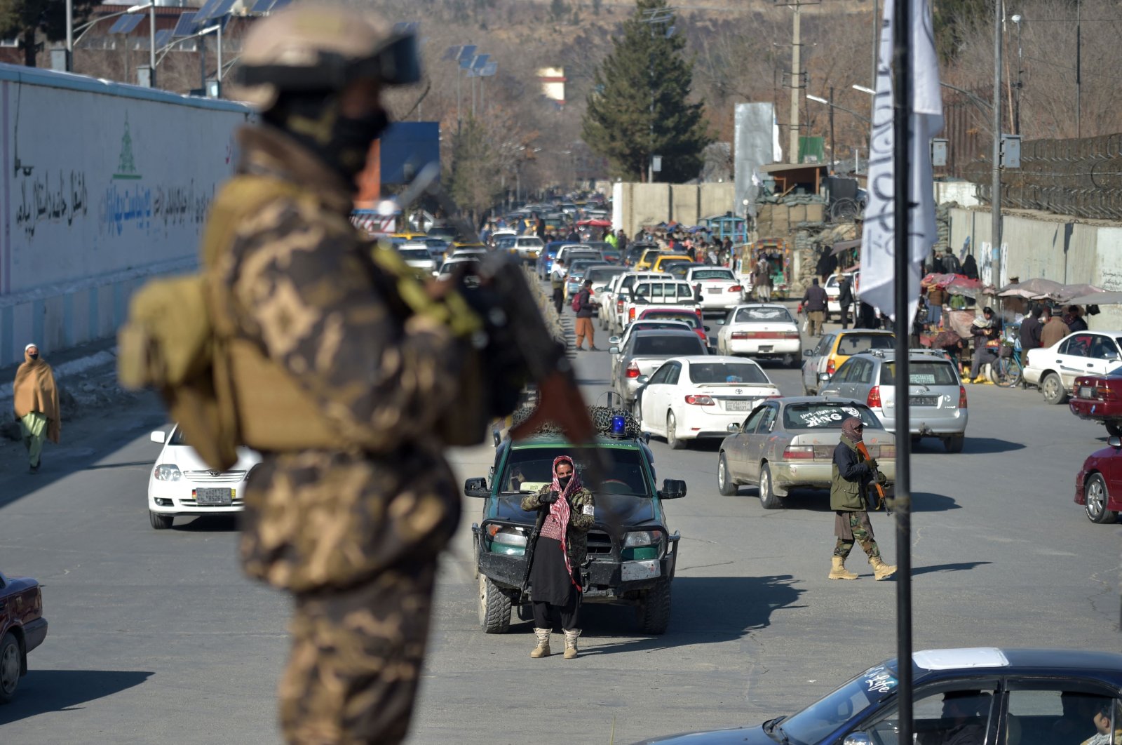 Taliban fighters stand guard before a protest in support of the Taliban regime at the Ahmad Shah Massoud square in front of the U.S. Embassy in Kabul, Afghanistan, Jan. 26, 2022. (AFP Photo)