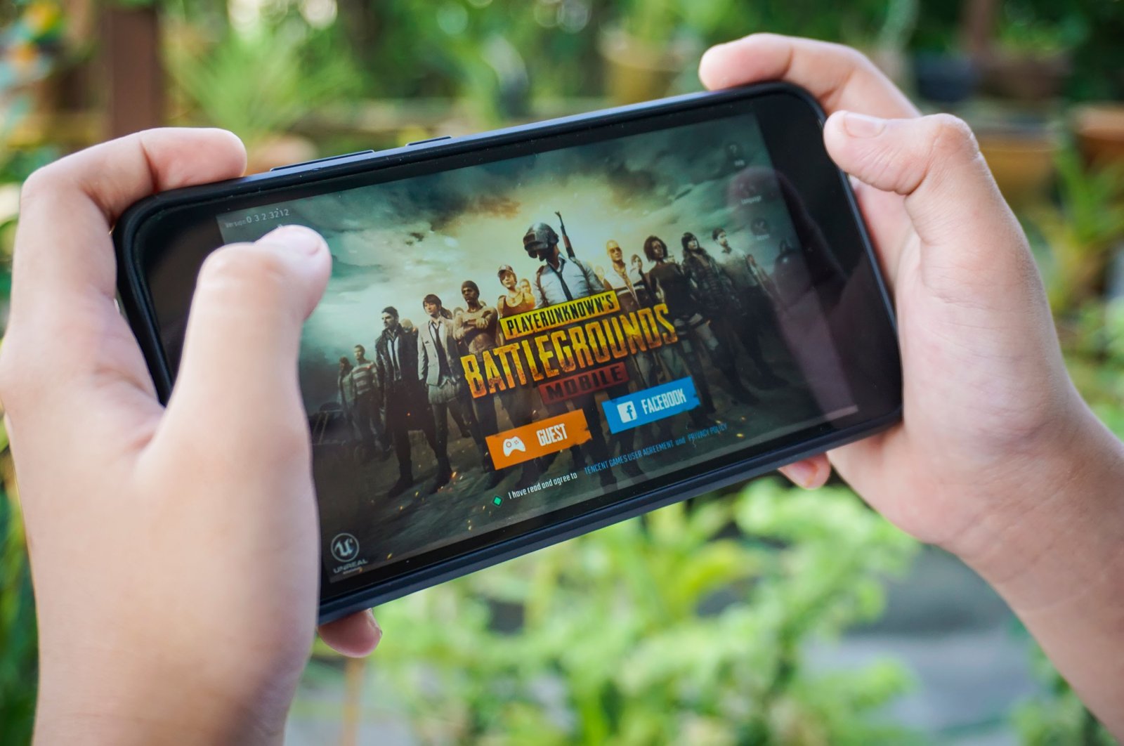 Hand holding a smartphone with Player&#039;s Unknown Battleground, also known as PUBG, online shooting game, Kuala Lumpur, Malaysia, Sep. 7, 2018. (Shutterstock)
