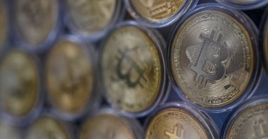 Physical imitations of Bitcoins are pictured at a cryptocurrency exchange branch near the Grand Bazaar in Istanbul, Turkey, Oct. 20, 2021. (AFP Photo)