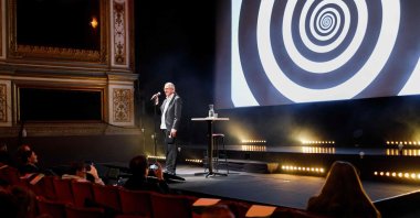 This handout photo made available by the Goteborg Film Festival shows hypnotist Fredrik Praesto addressing the audience prior to the first screening of the Hypnotic Cinema at the Stora Teatern in Gothenburg, Sweden, Jan. 30, 2022. (AFP)
