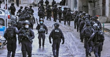 Israeli security forces patrol around the area near the family home of Palestinian Hamas member Fadi Abu Shkhaydam, killed by Israeli police last year, ahead of its demolition in the Shufat refugee camp in Jerusalem, Feb. 1, 2022. (AFP File Photo)