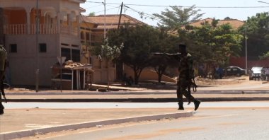 A soldier patrol the government palace area in Bissau, capital of Guinea-Bissau, on February 1, 2022. (AFP Photo)