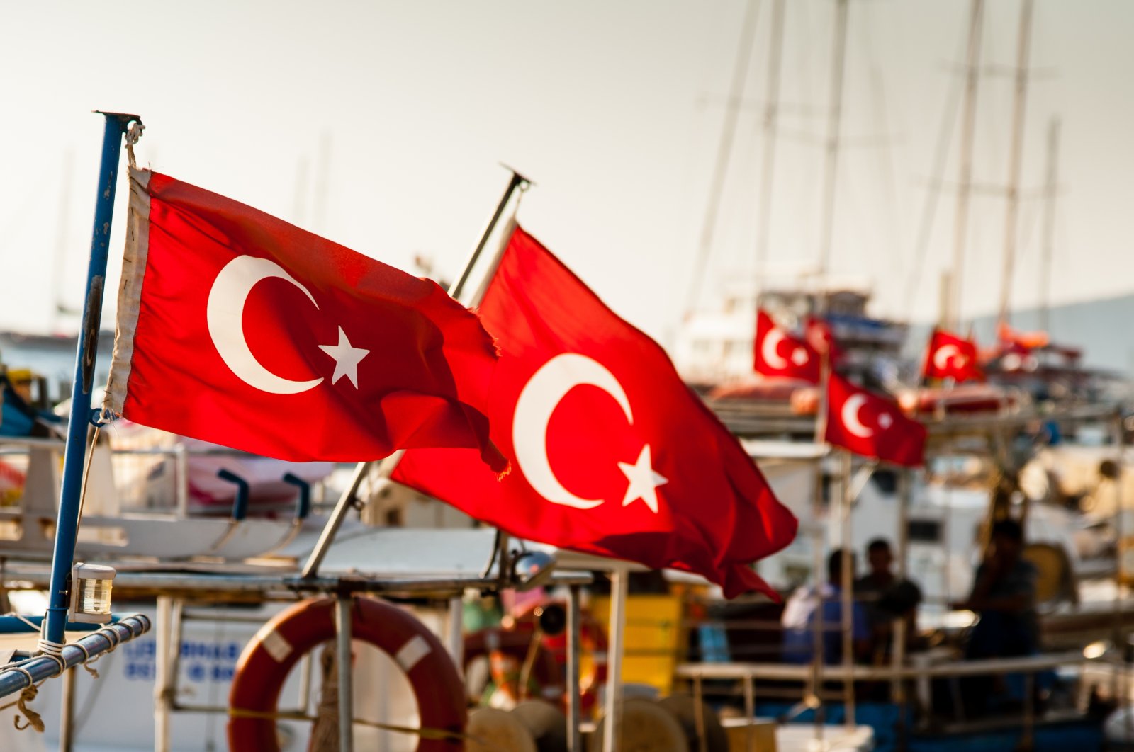 Turkish flags on boats moored in Bodrum, Turkey. (Shutterstock Photo)