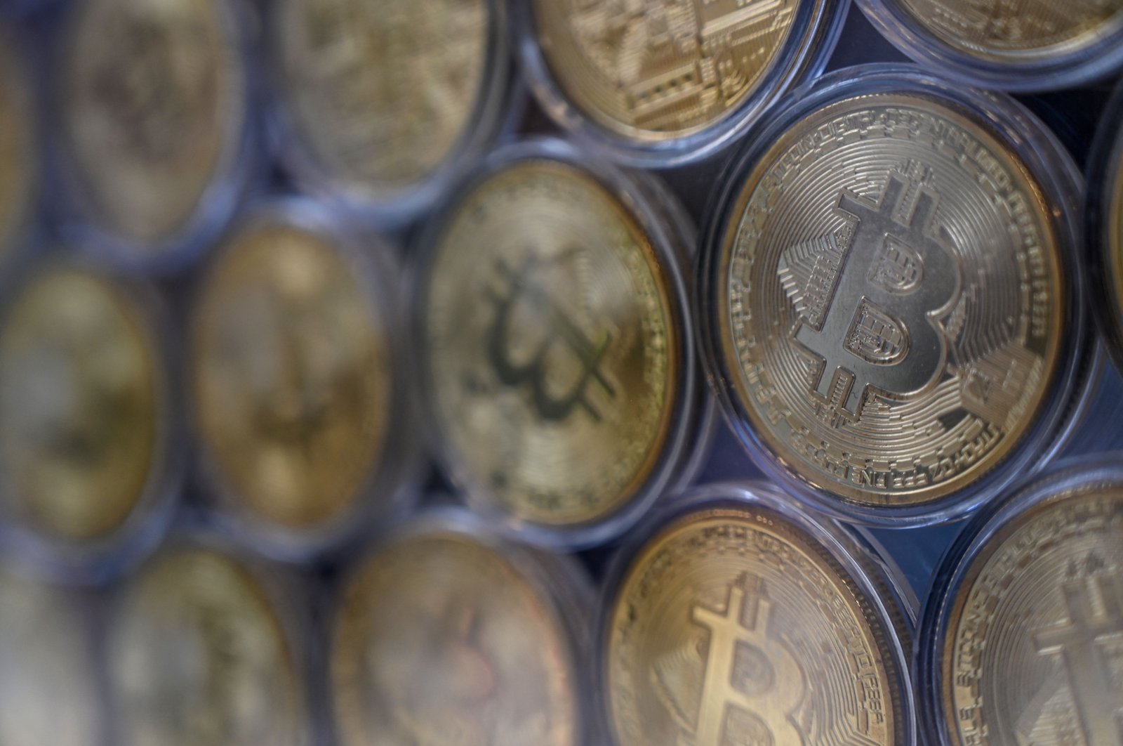 Physical imitations of Bitcoins are pictured at a cryptocurrency exchange branch near the Grand Bazaar in Istanbul, Turkey, Oct. 20, 2021. (AFP Photo)