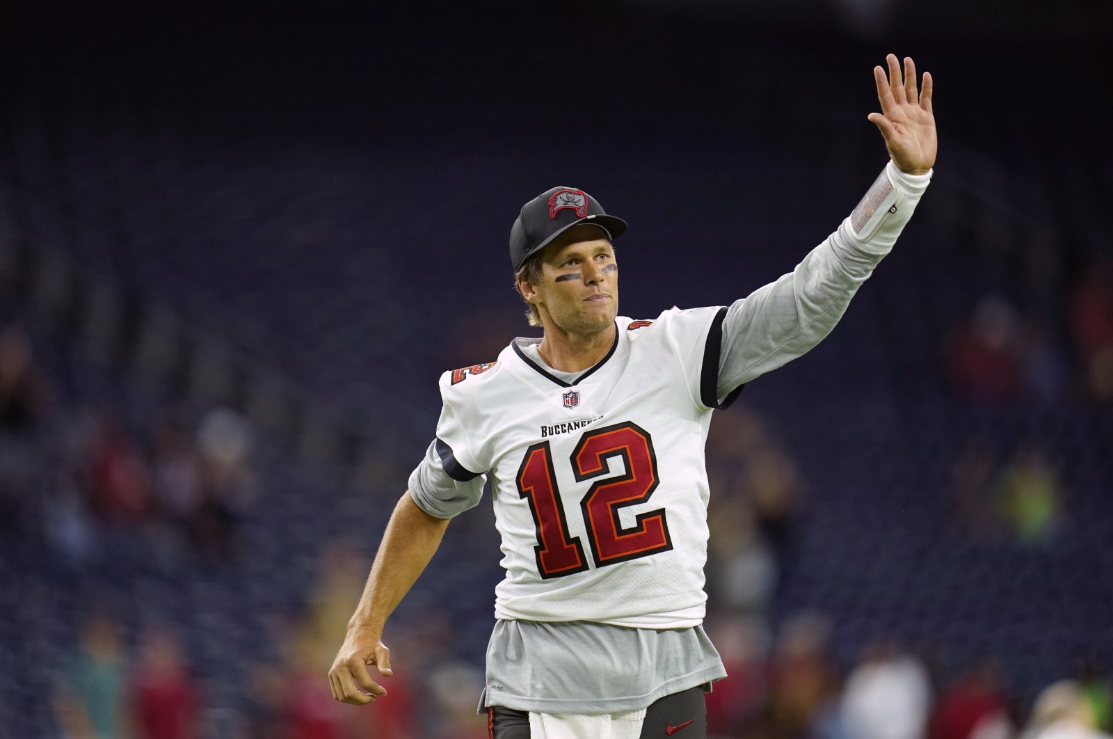 Tampa Bay Buccaneers quarterback Tom Brady waves toward the fans as he leaves the field after an NFL game against the Houston Texans, Houston, Texas, U.S., Aug. 28, 2021. (AP Photo)