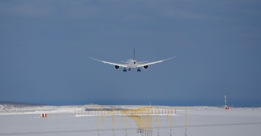 A plane landing at snow-covered Istanbul Airport, Istanbul, Turkey, Wednesday, Jan. 26, 2022. (AP Photo)