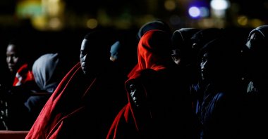 Migrants wait to disembark from a Spanish coast guard vessel at the port of Arguineguin, on the island of Gran Canaria, Spain, Jan. 26, 2022. (Reuters Photo)
