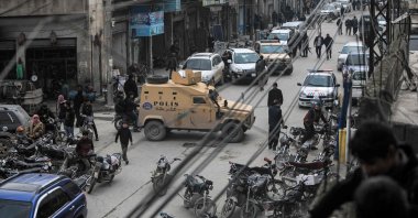 A police vehicle is stationed along a street in the city of al-Bab in Syria's northern Aleppo province on the border with Turkey, Jan. 31, 2022 (AFP Photo)