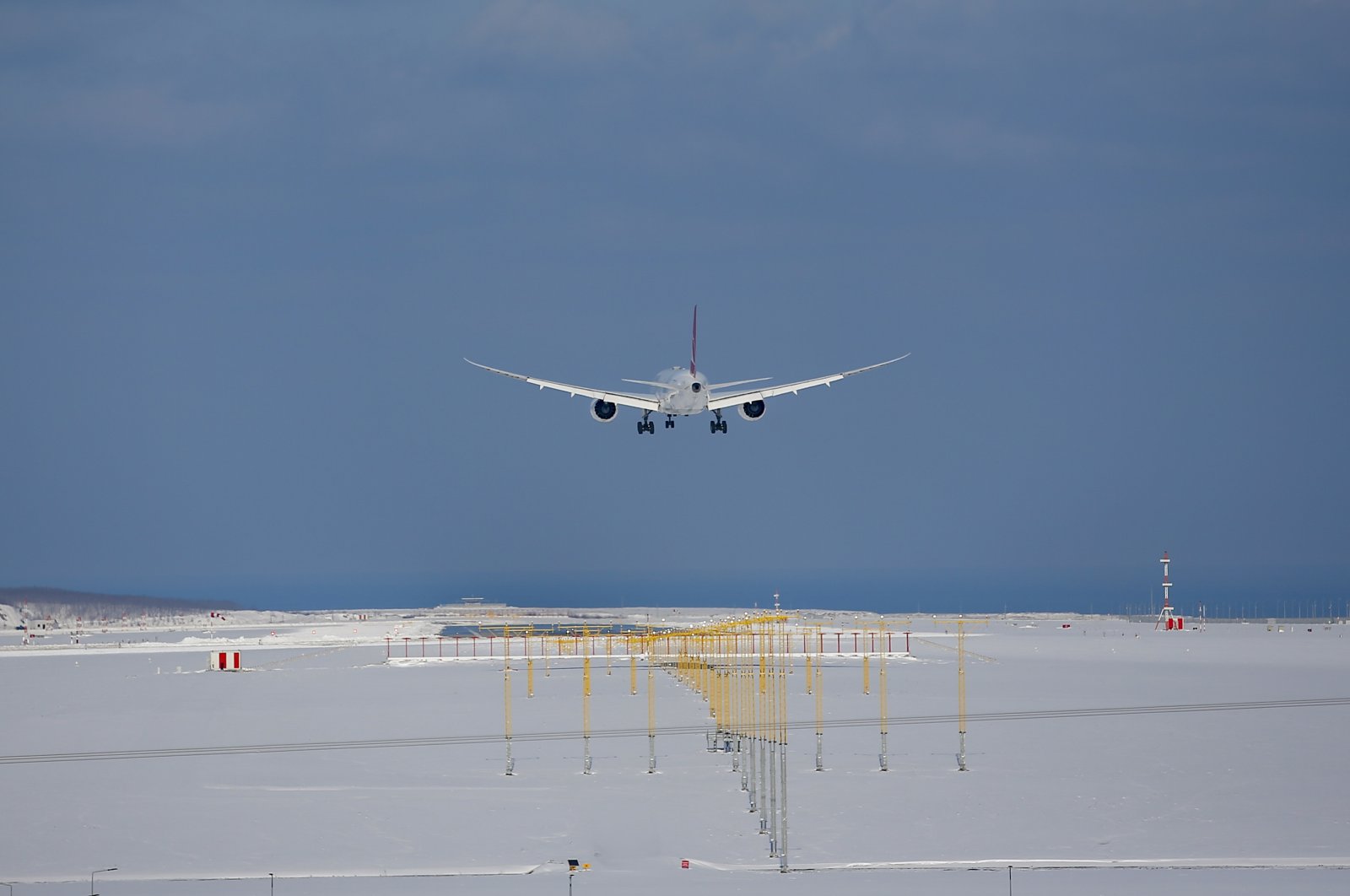 A plane landing at snow-covered Istanbul Airport, Istanbul, Turkey, Wednesday, Jan. 26, 2022. (AP Photo)