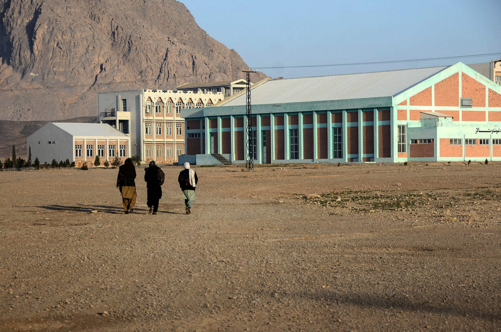 Students walk in the courtyard of Kandahar University as the Taliban reopened public universities across some provinces, in Kandahar, Afghanistan, Feb. 2, 2022. (AFP Photo)