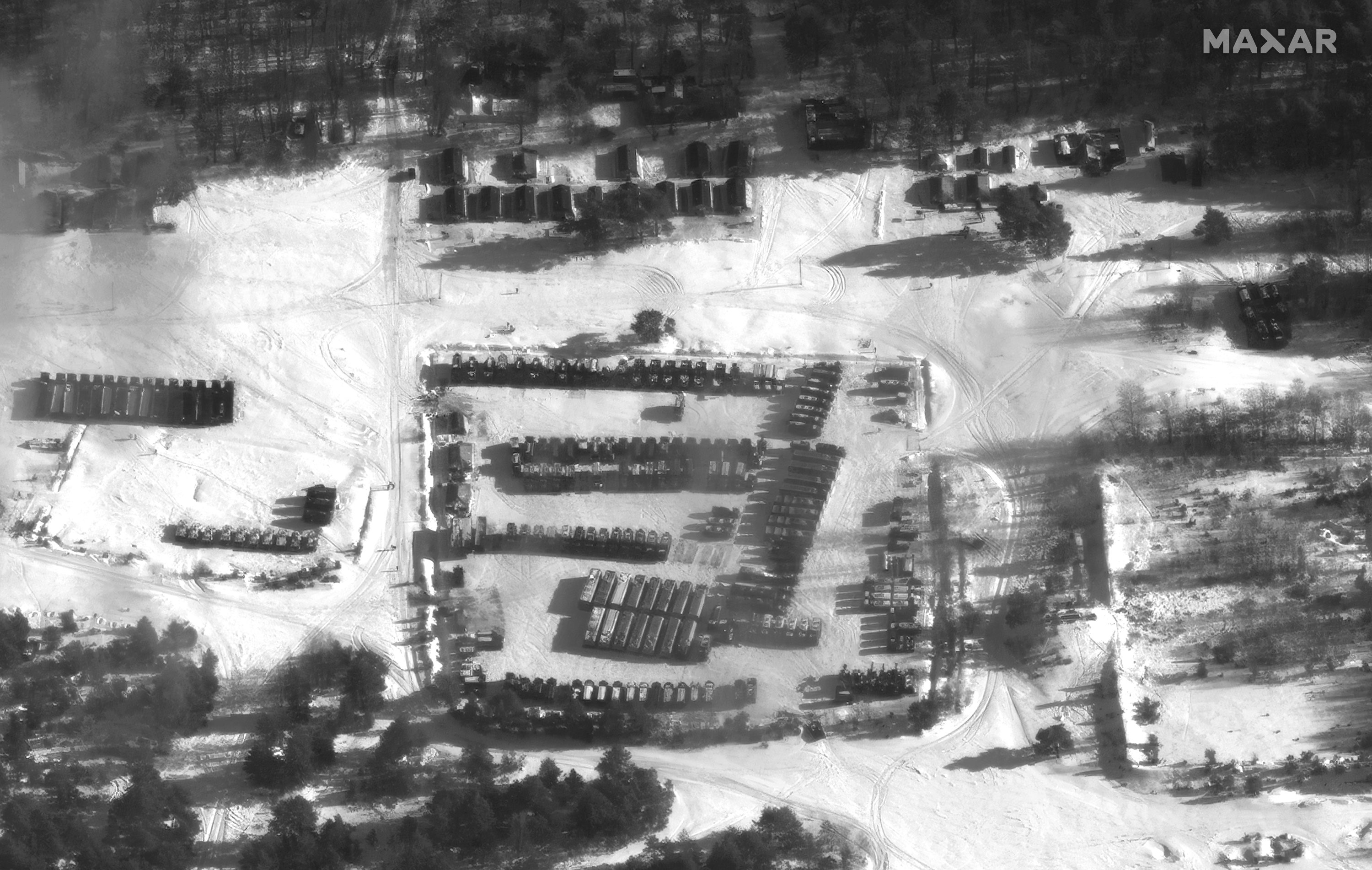 This satellite image provided by Maxar Technologies shows SS26 Iskander missiles gathered in the Osipovichi training area, at Brestsky, Belarus, Jan. 30, 2022. (Maxar Technologies via AP)