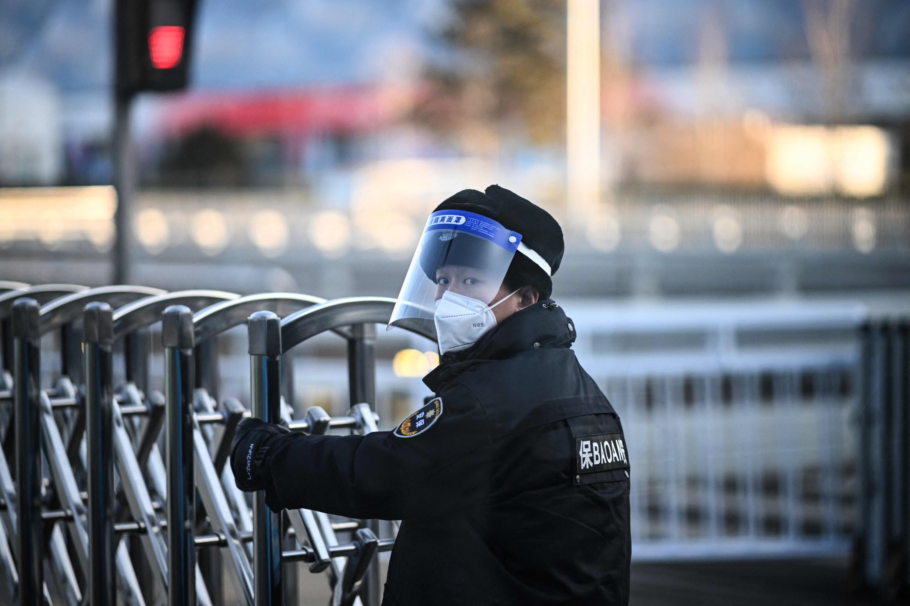 A security staff opens a barrier at a checkpoint on a road within the Beijing Games closed-loop bubble, Beijing, China, Feb. 3, 2022. (AFP Photo)