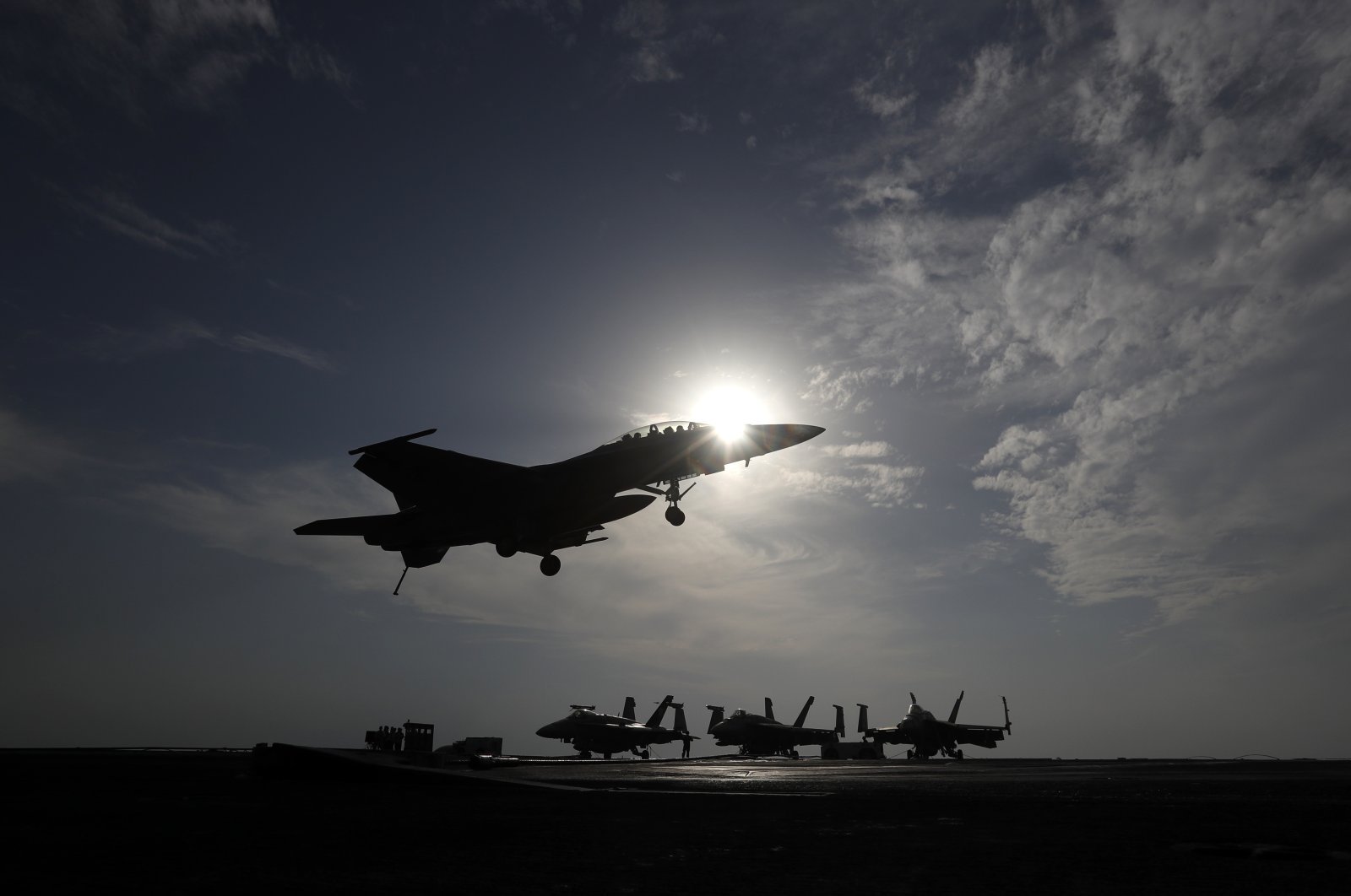A U.S. Navy fighter jet lands on the deck of the U.S.S. Dwight D. Eisenhower aircraft carrier. The carrier is currently deployed in the Persian Gulf, supporting Operation Inherent Resolve, the military operation against Daesh in Syria and Iraq, Nov. 21, 2016. (AP File Photo)