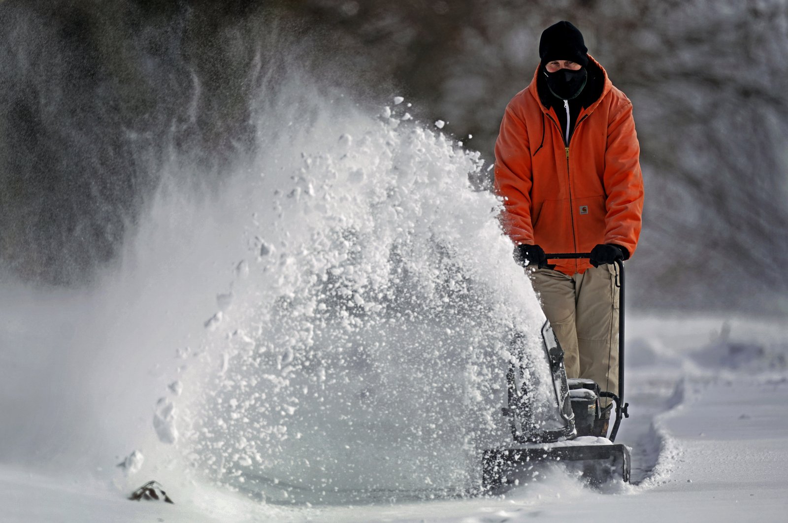 John Tapko clears snow at his house, Feb. 2, 2022, in Overland Park, Kansas, U.S. (AP Photo)