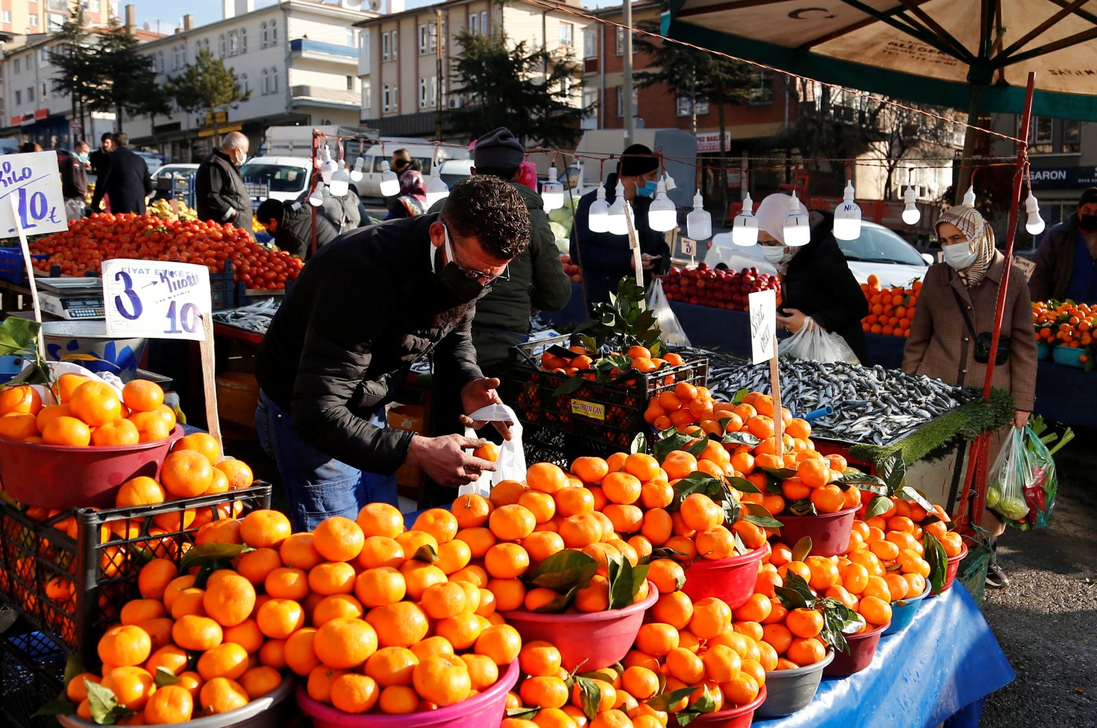 People shop at an open market in Ankara, Turkey, Jan. 4, 2022. (Reuters Photo)